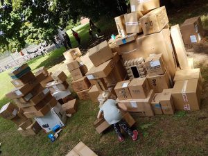 Children building with cardboard boxes at Playday.